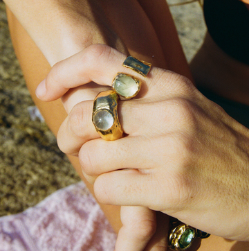 a person holding a pair of rings