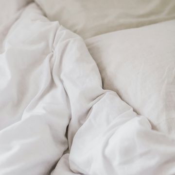 a white sheet with a white pillow