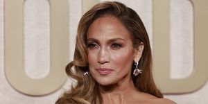 jennifer lopez wears a blowout curly hair style on the red carpet