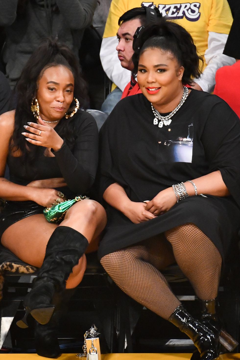 https://hips.hearstapps.com/hmg-prod/images/singer-lizzo-attends-a-basketball-game-between-the-los-news-photo-1596641390.jpg?crop=0.410xw:0.921xh;0.386xw,0.0408xh&resize=980:*