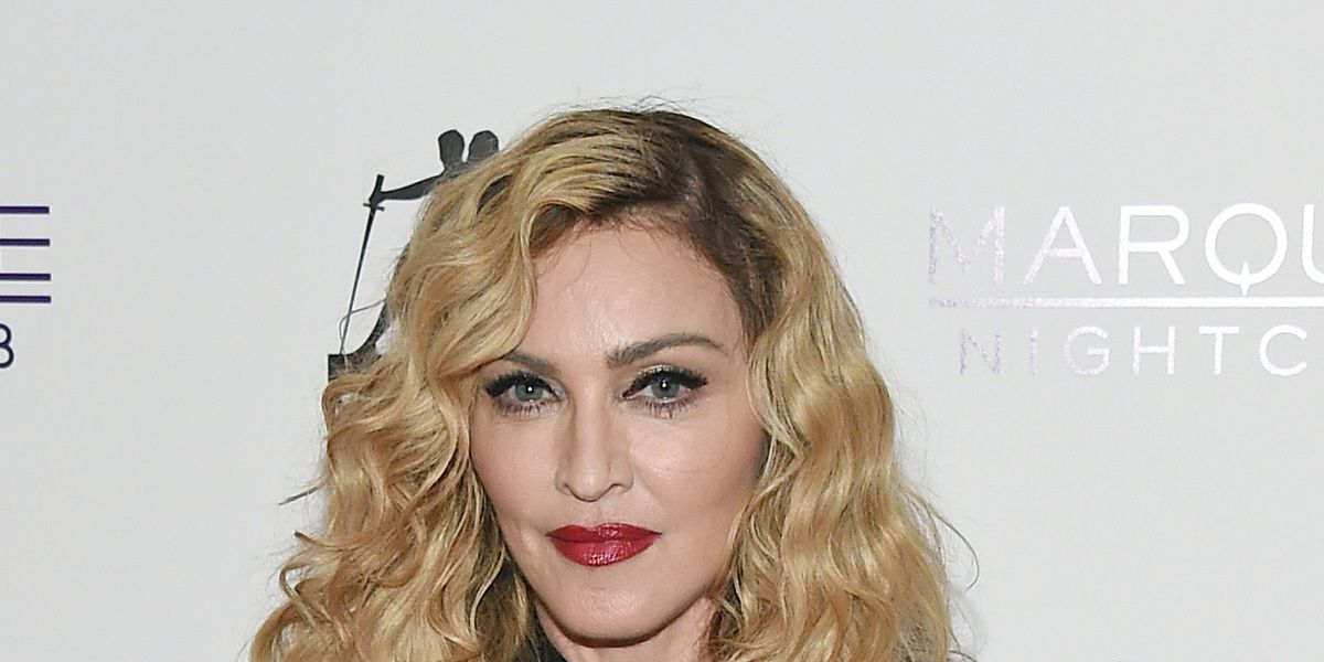 Madonna Uploaded a Super-Relatable Instagram of Herself Posing Topless with  a Louis Vuitton Handbag