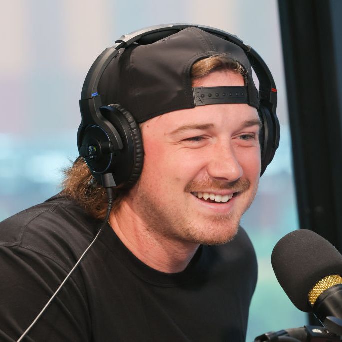 morgan wallen with headphones on talking for a radio interview