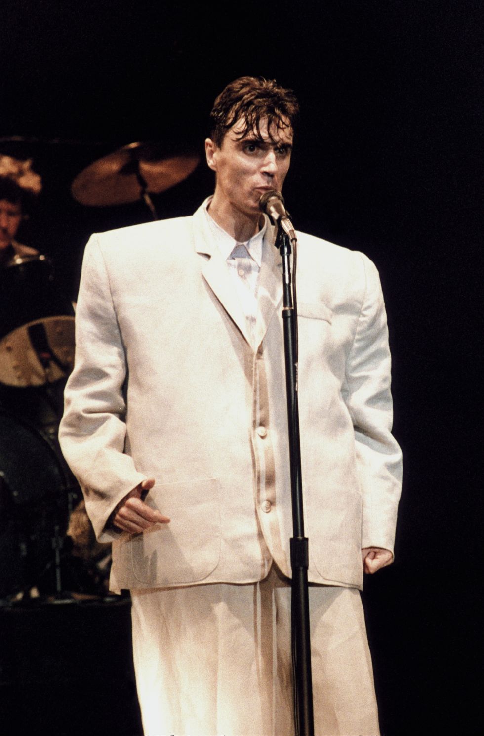 david byrne performing in concert with talking heads