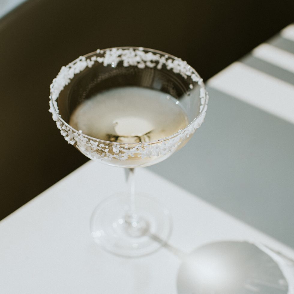 https://hips.hearstapps.com/hmg-prod/images/single-glass-of-margarita-with-salted-rim-on-a-royalty-free-image-1663065122.jpg?crop=0.614xw:1.00xh;0.172xw,0&resize=980:*