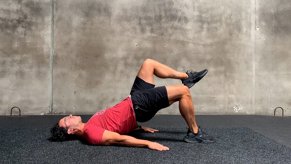 man doing single leg glute bridge exercise