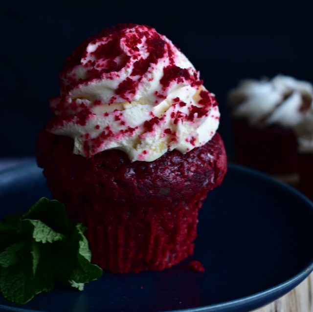 single red velvet cupcake with icing on top