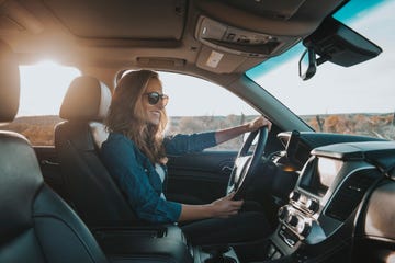 single woman driving a car