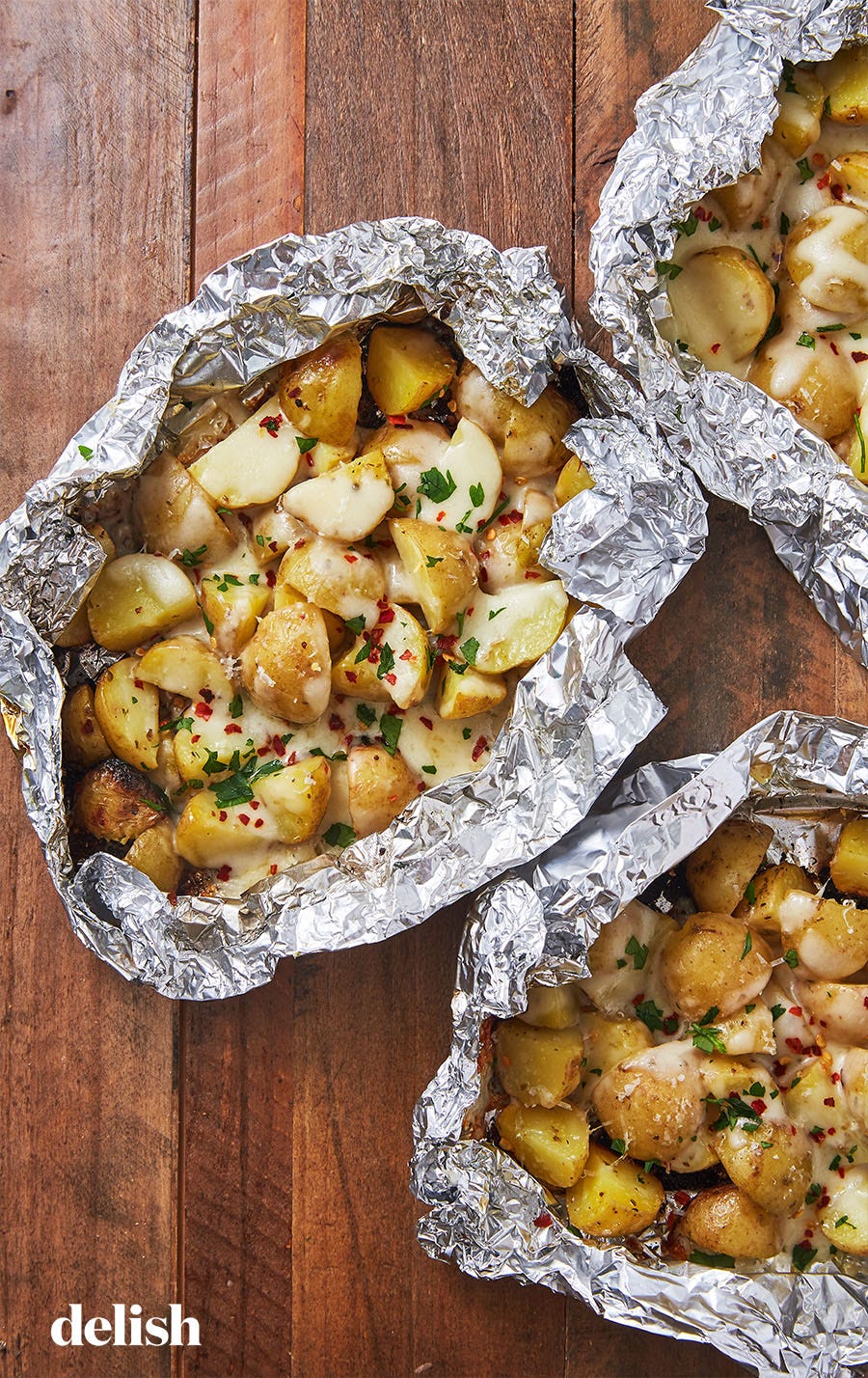 Cheesy Foil Pack Potatoes - Delish.com