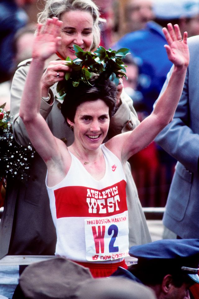 joan benoit wearing athletics west singlet while getting crowned winner of the 1983 boston marathon