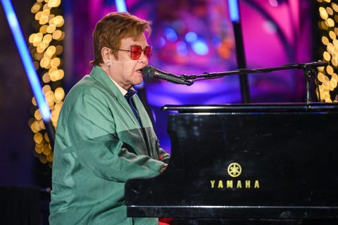 elton john performing at 2022 saks fifth avenue holiday windows