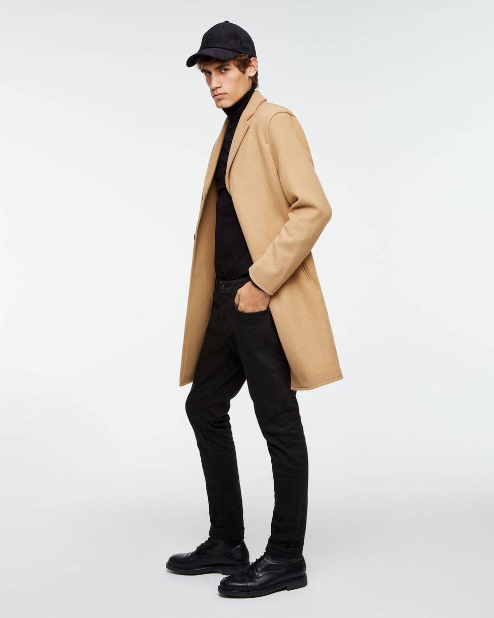 Clothing, Overcoat, Coat, Standing, Beige, Outerwear, Trench coat, Khaki, Collar, Footwear, 