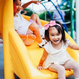 sisters playing together in the park