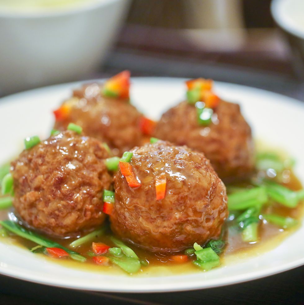 sixi balls, also known as lions head meatballs w vegetable garnish served at lunchtime in yokohama