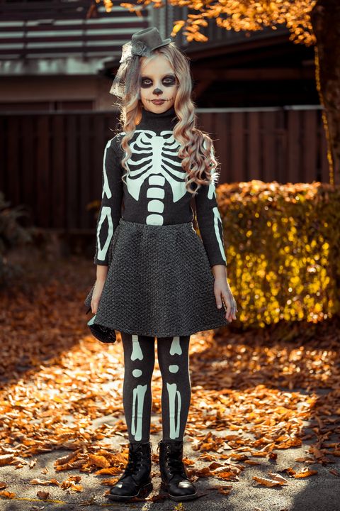 diy skeleton costume on boy in pumpkin patch