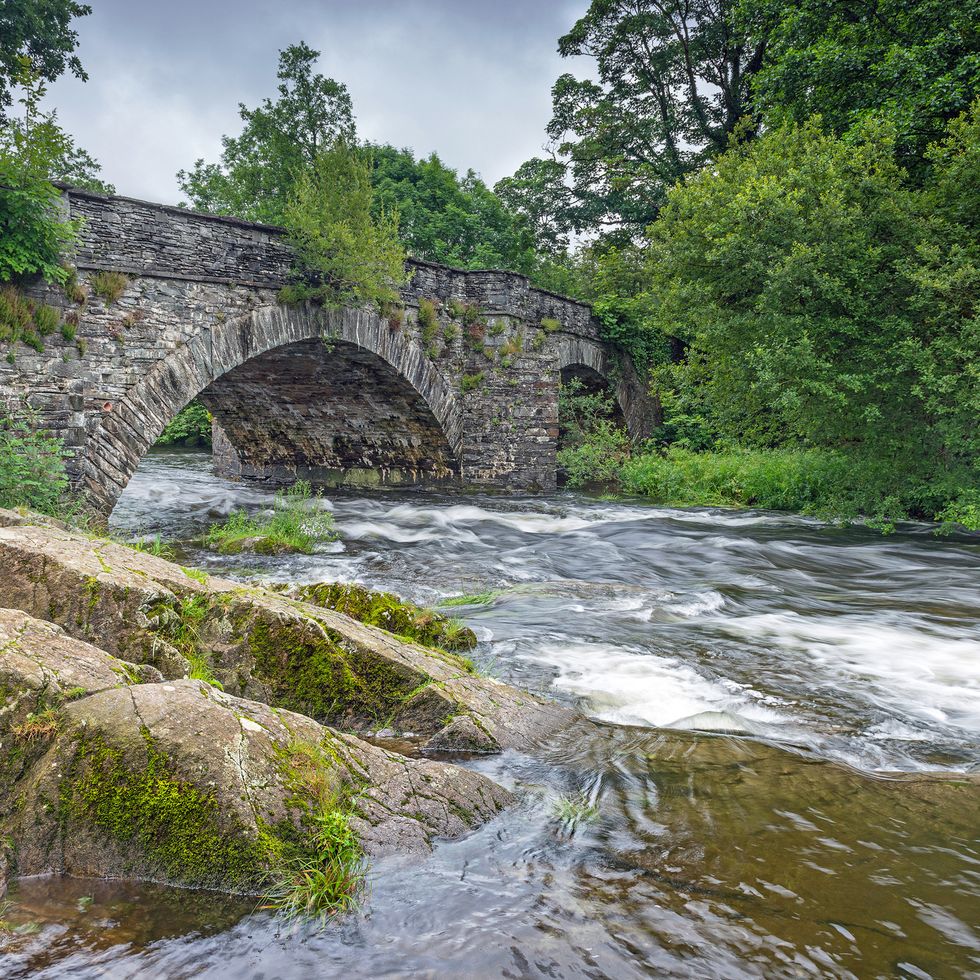 the river brathay flows under skelwith bridge near ambleside in the lake district national park, cumbria, england a popular area for tourists