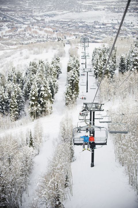 skiers on a ski lift