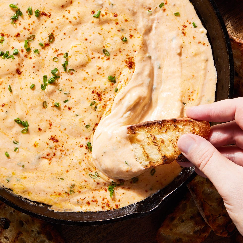 skillet beer cheese with a piece of toasted bread