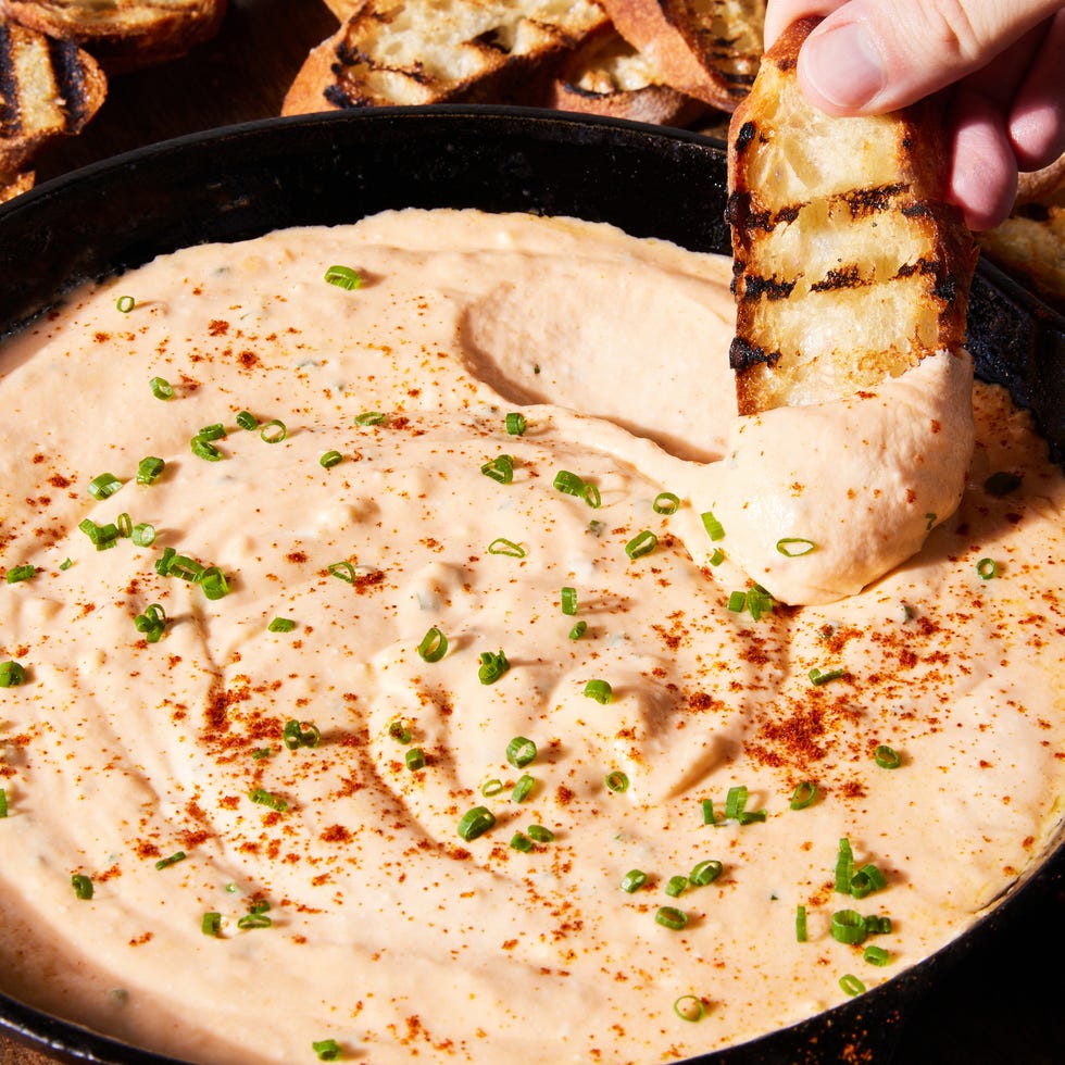 skillet beer cheese with a piece of toasted bread
