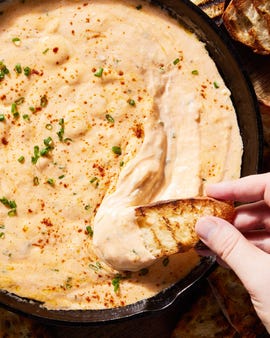 skillet beer cheese with a piece of toasted bread