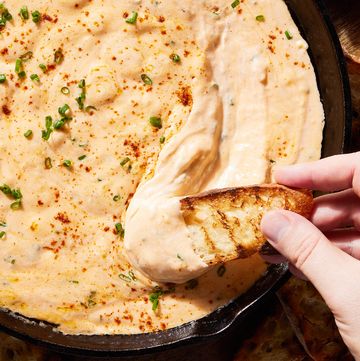 skillet beer cheese with a piece of toasted bread