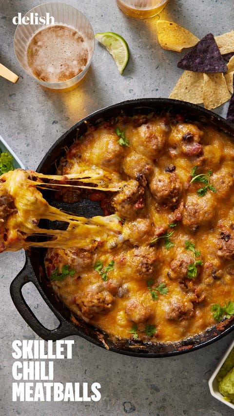 Skillet Chili & Meatballs chili and meatballs in a cast iron skillet, topped with melty cheese