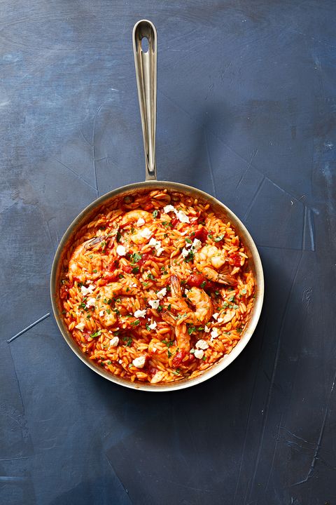 shrimp and orzo in a skillet pan
