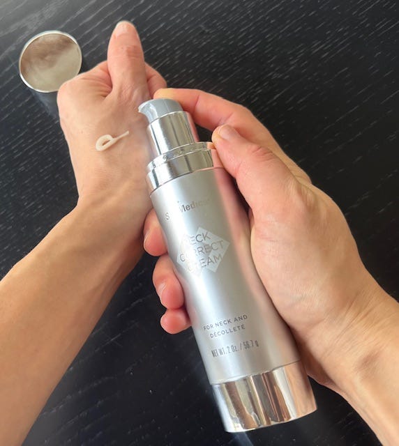 a photo of a good housekeeping editor testing a skinmedica neck cream