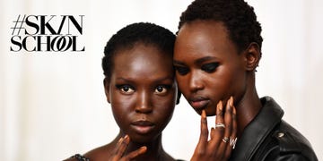 a close up image of two women with their hands on their chins.