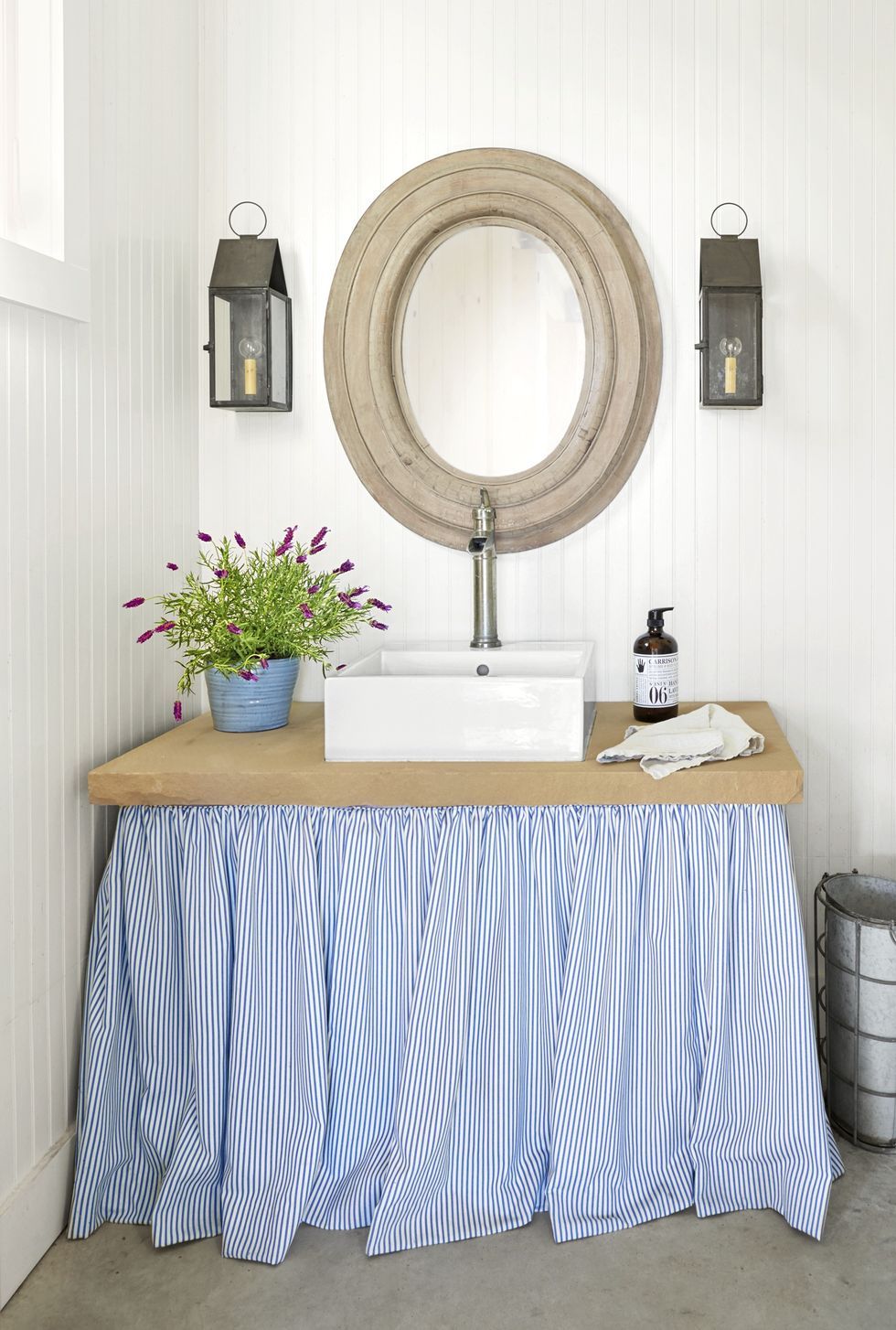 Skirted sink with blue and white striped fabric