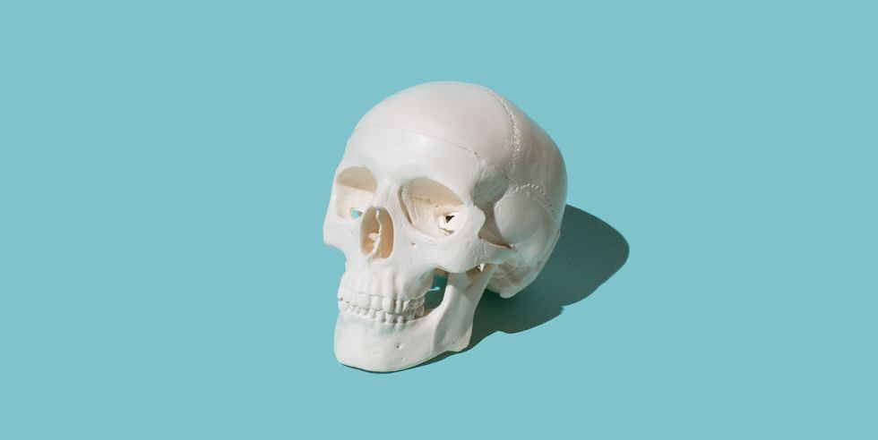 skull on blue background happy halloween concept