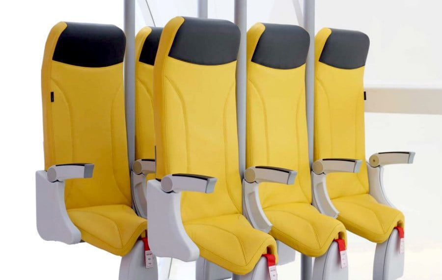 Yellow, Product, Car seat, Chair, Vehicle, Personal protective equipment, Outerwear, Auto part, Head restraint, Furniture, 
