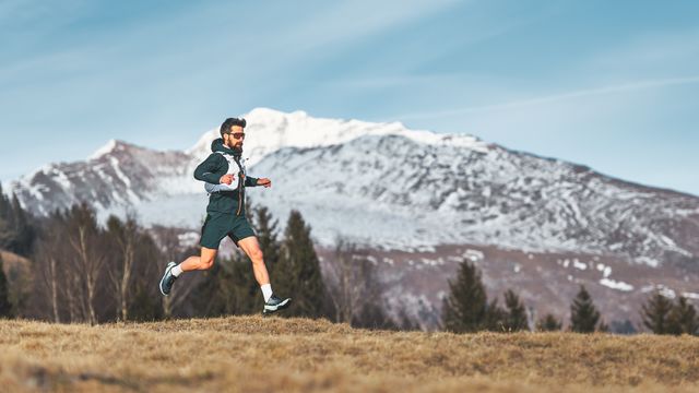 a skyrunner athlete man run in the high mountains