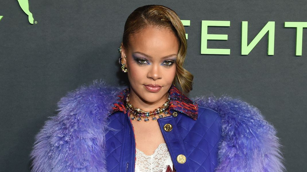 Rihanna Returns to the Carpet in a Purple Fur Coat and Matching Sneakers