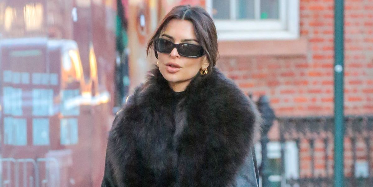 Emily Ratajkowski looks stunning in black fur-lined trench coat