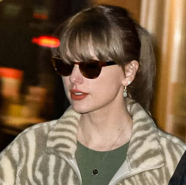Taylor Swift's Off-Duty Look Includes a Fuzzy Zebra Sweater and Ivy Park Sneakers