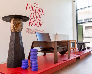 a gallery with chairs and ornaments on display