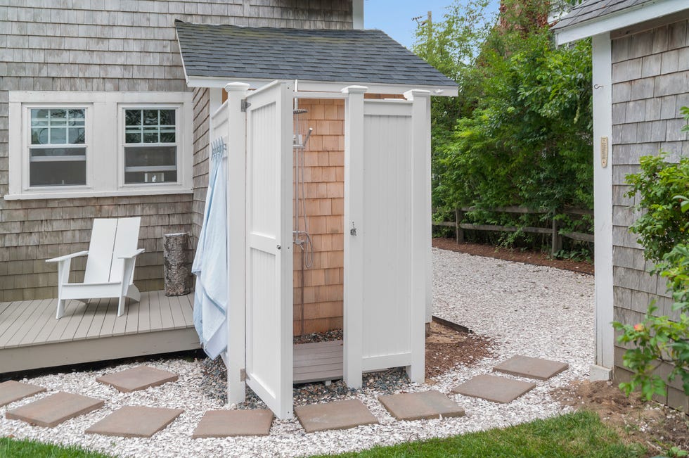 a cape cod style outdoor shower enclosure