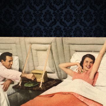 a man and woman lying in bed