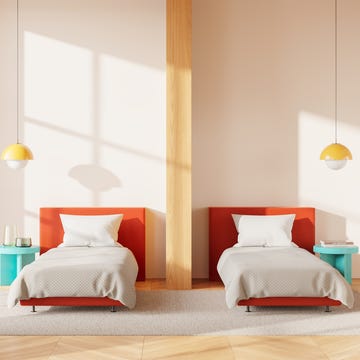 sleep divorce concept separate beds minimalist bedroom with two orange single beds, pendant lamps, and a wooden pillar, large window with a city view, cozy and modern concept. 3d rendering; shutterstock id 2536324181; magazine_title_and_month: gh digi sleep divorce; ordered_by: jodie anderson; client: