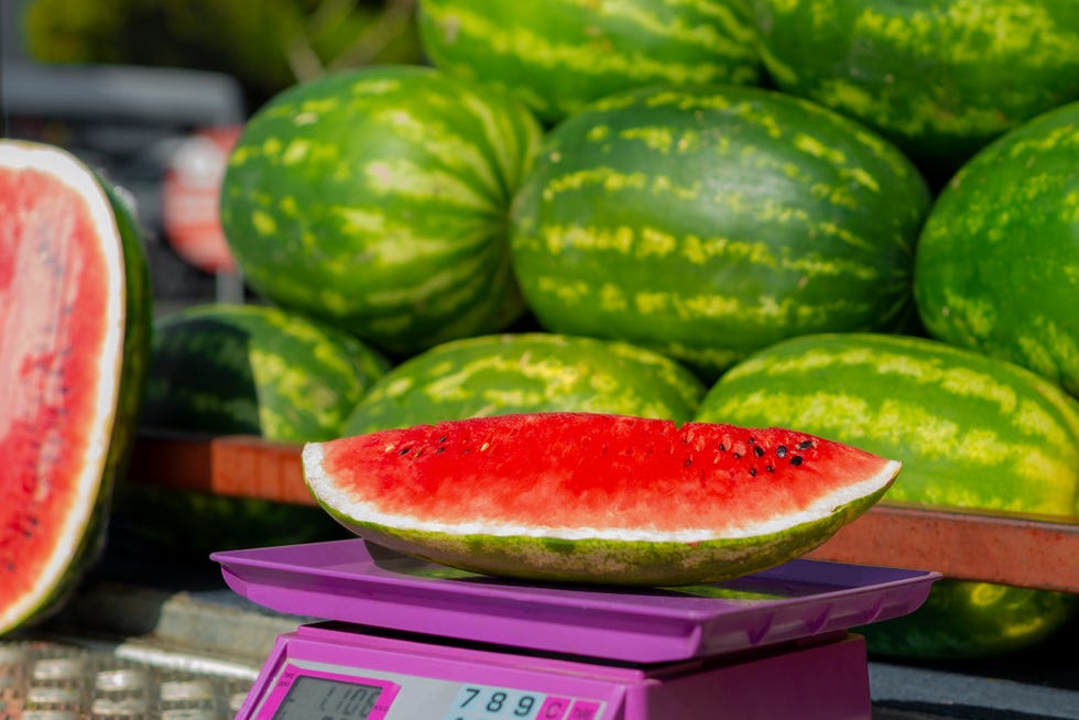 a slice of watermelon, whose weight is measured on the scale