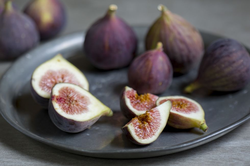 sliced and whole figs on plate