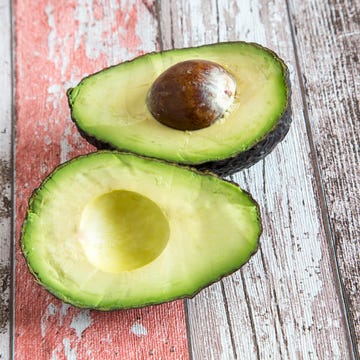 Sliced avocado on wood