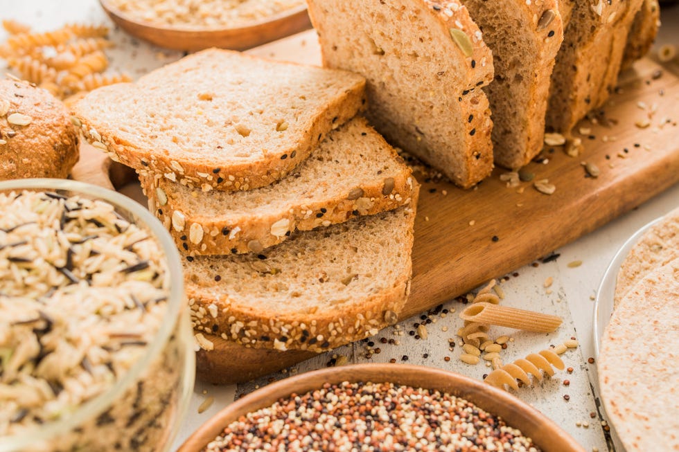 Healthy Carbs: Sliced brown bread on cutting board