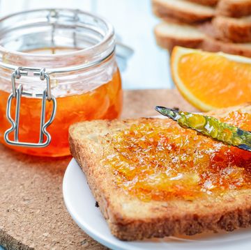 Slices of toasted bread with orange jam for breakfast