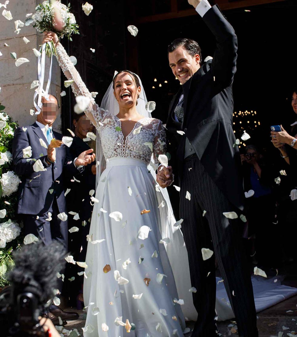 a man and woman in wedding attire