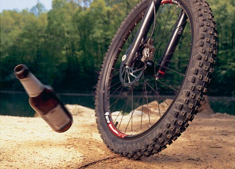 mountain bike wheel flicking debris out of the way