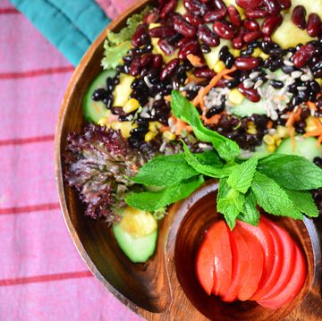 vegan food bean salad with pineapple carrot, cucumber, oil, pineapple, sweetcorn, lettuce, tomato and bean