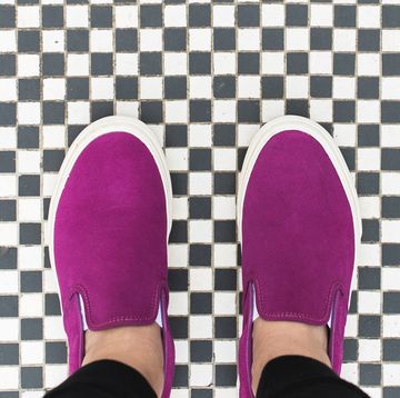 magenta slip on sneakers on checkerboard tile floor