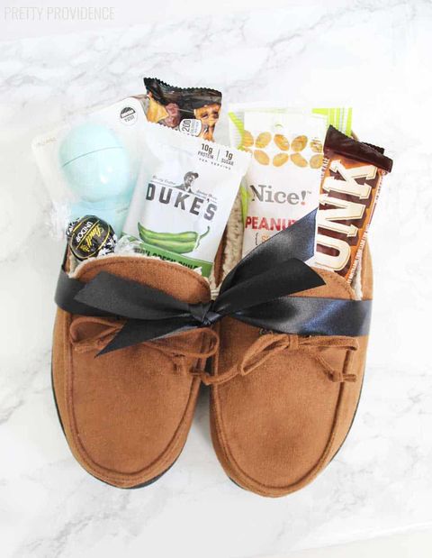 leather moccasin slippers tied with ribbon and filled with snacks