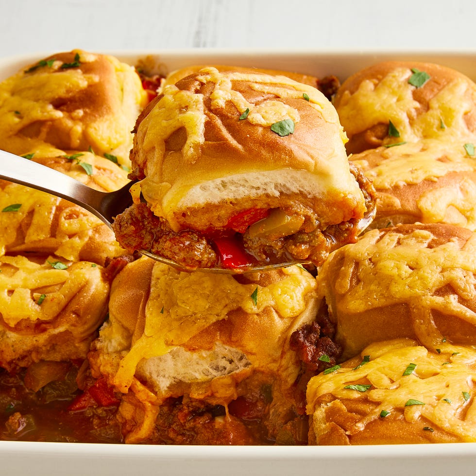 casserole dish with sloppy joe mixture topped with mini buns and melted cheese